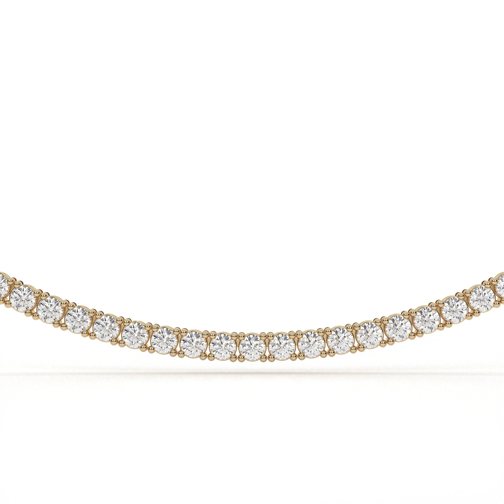 Gold necklace with clear gemstones on a white background