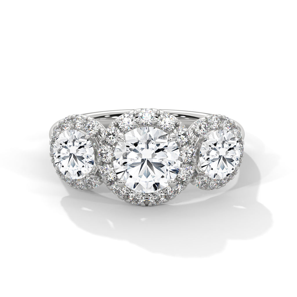 Diamond ring with three circular diamonds on a white background