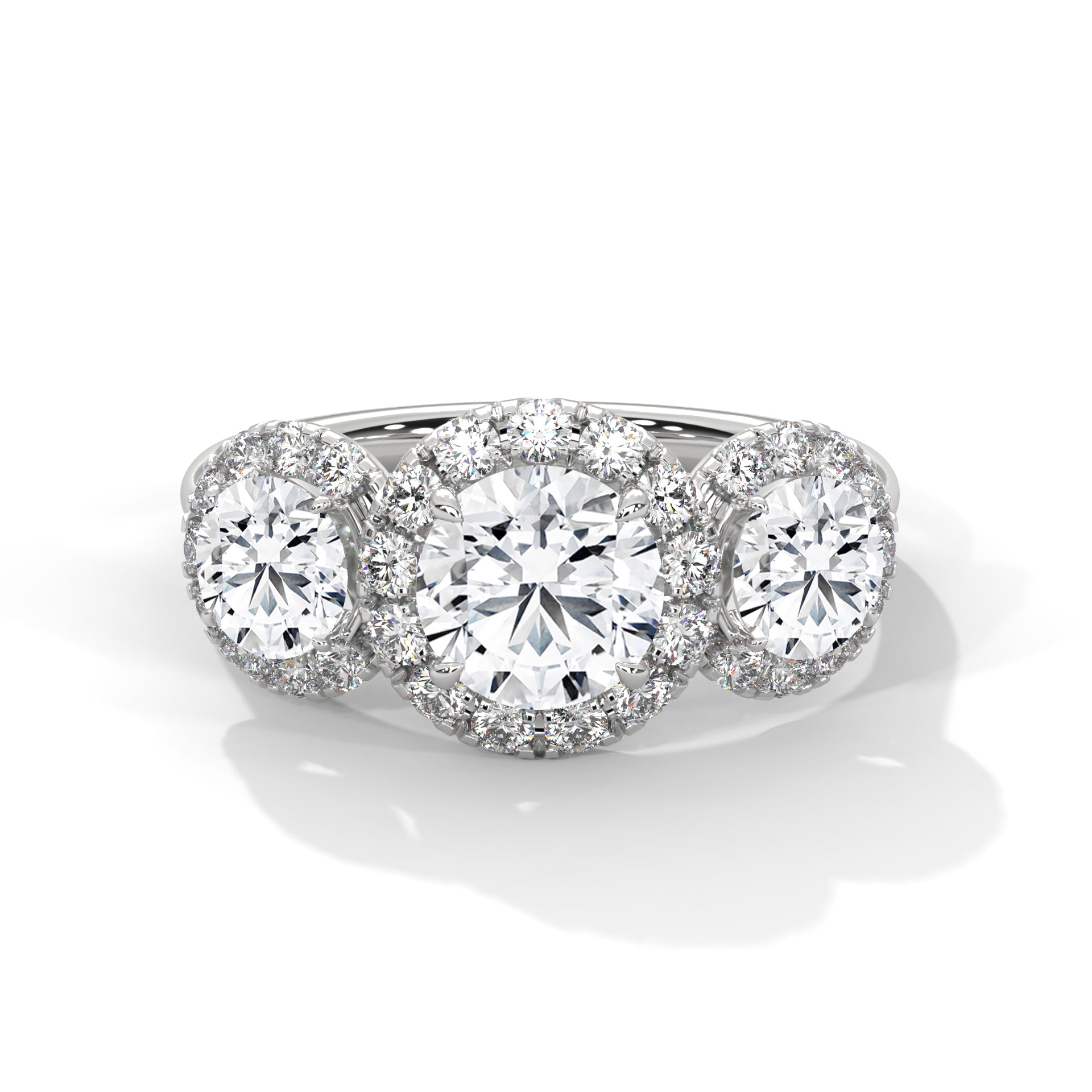 Diamond ring with three circular diamonds on a white background