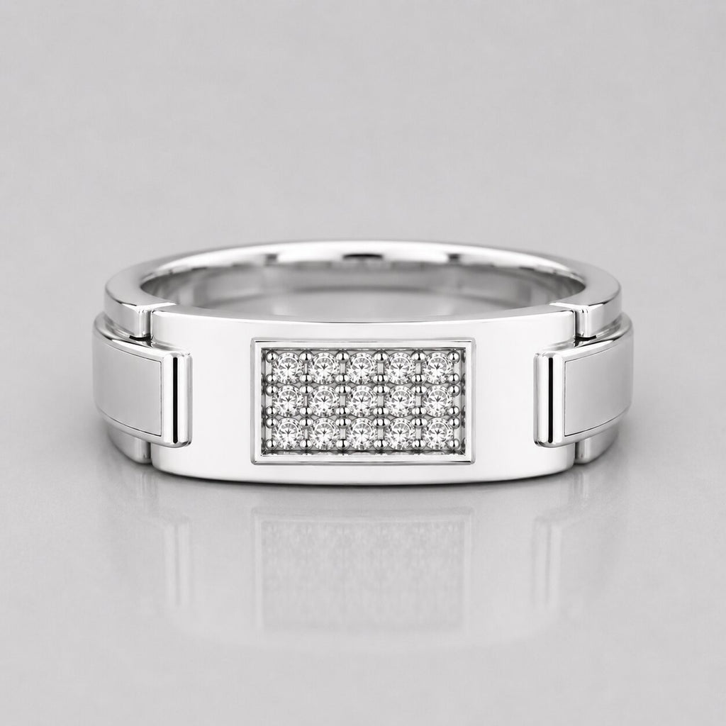 Silver ring with diamond-studded center on a light gray background