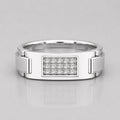 Silver ring with diamond-studded center on a light gray background