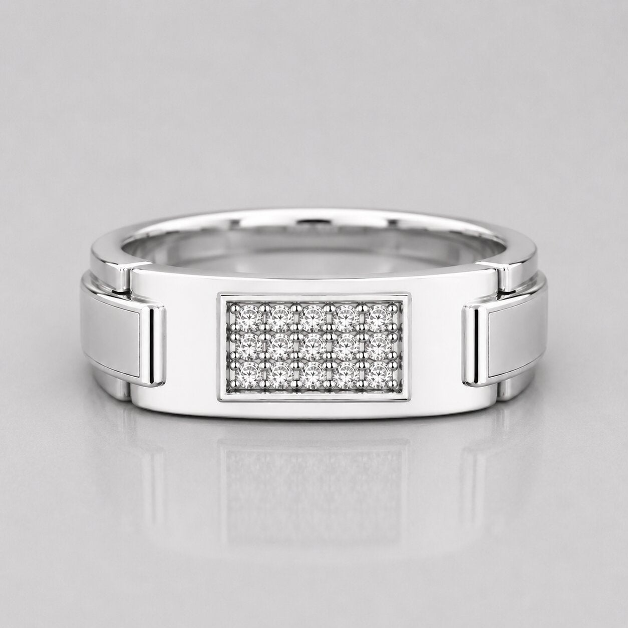 Silver ring with diamond-studded center on a light gray background