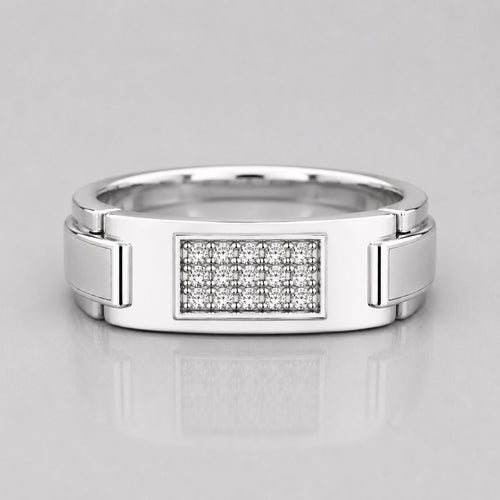 Silver ring with diamond-studded center on a light gray background
