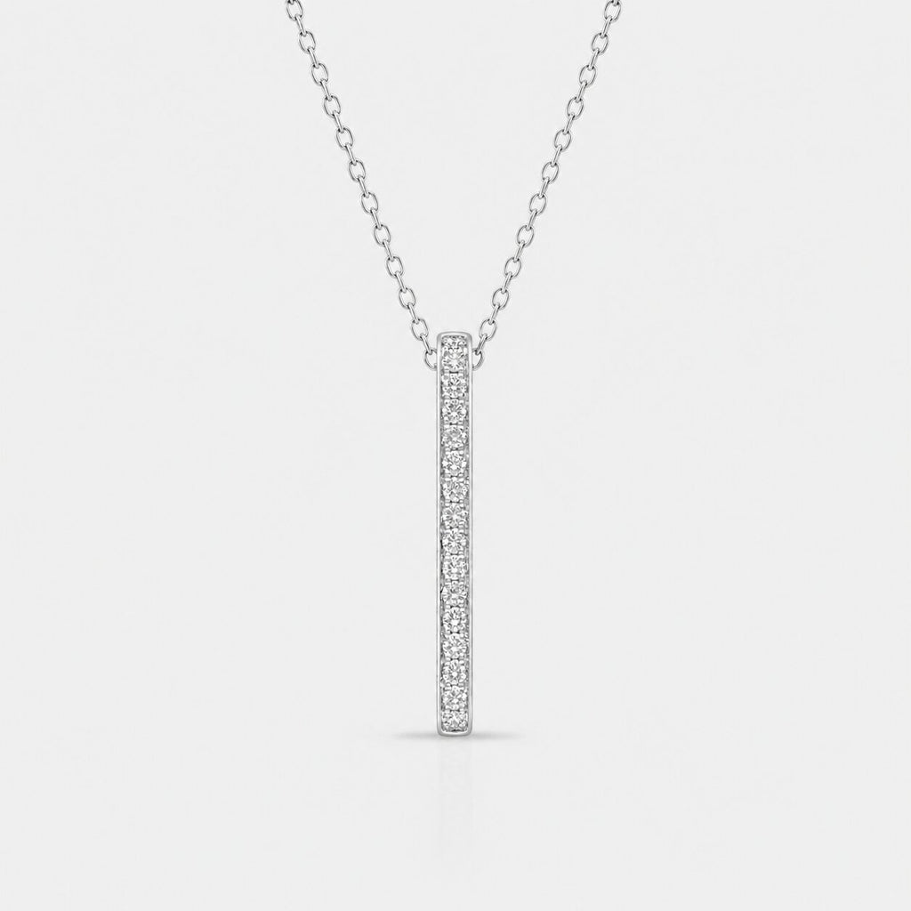 Silver necklace with a bar pendant on a light gray background