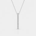 Silver necklace with a bar pendant on a light gray background