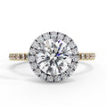 Diamond ring with a large central gemstone and smaller stones on a white background