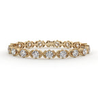 Gold bracelet with diamond accents on a white background