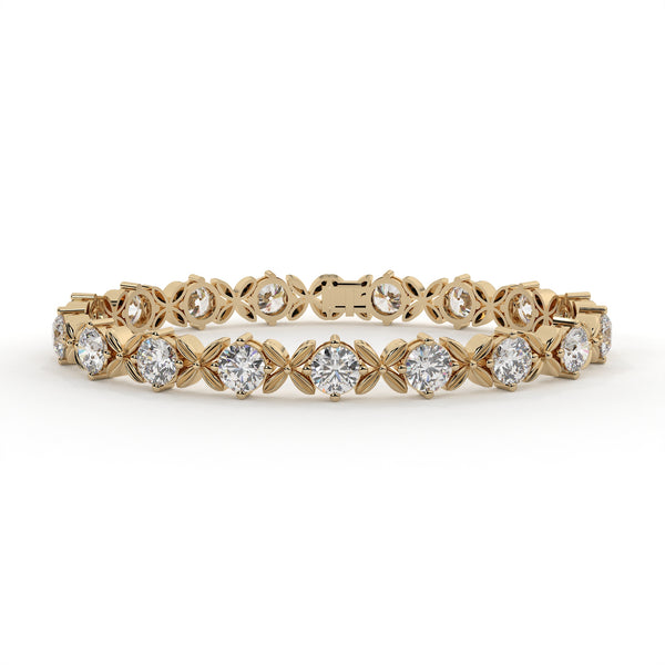 Gold bracelet with diamond accents on a white background