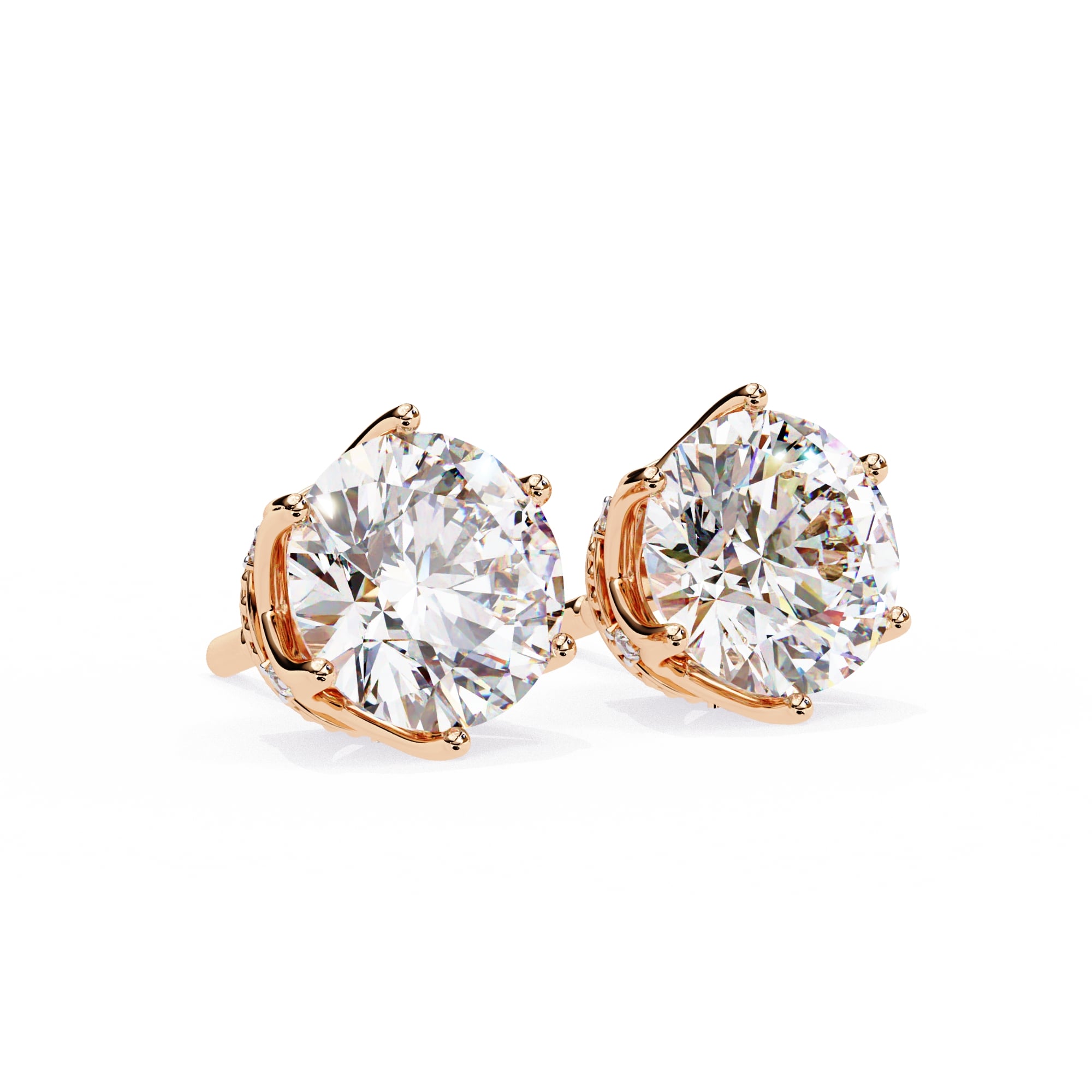 Rose gold stud earrings with large clear gemstones on a white background