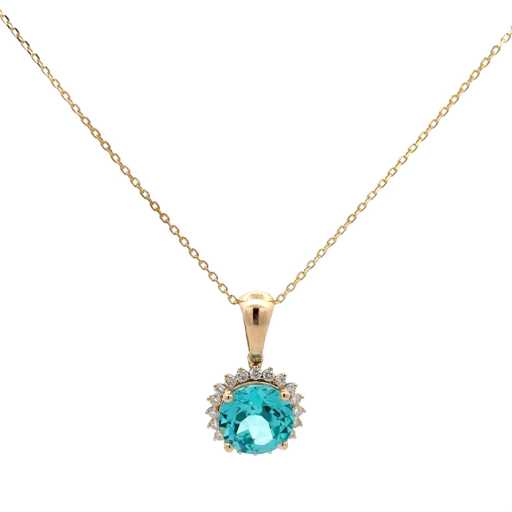 Gold necklace with a turquoise gemstone pendant on a white background