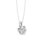 Heart-shaped diamond pendant on a white background