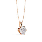 Rose gold necklace with a heart-shaped diamond pendant on a white background