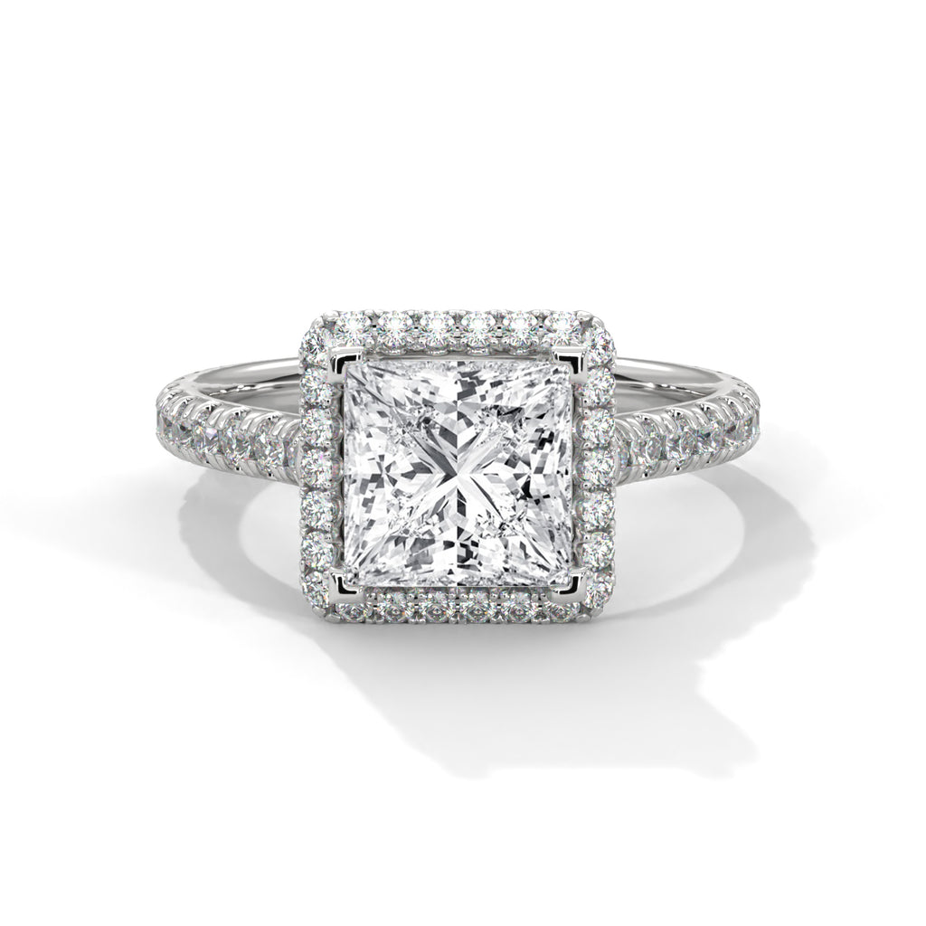 Diamond ring with a square-cut center stone on a white background