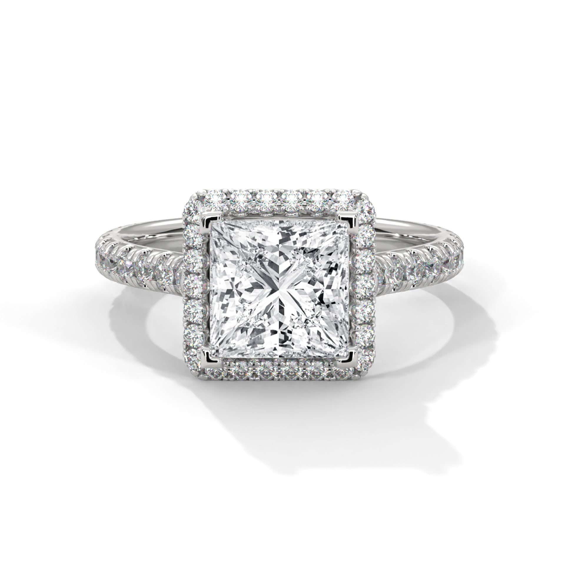 Diamond ring with a square-cut center stone on a white background