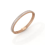Rose gold bracelet with clear gemstones on a white background