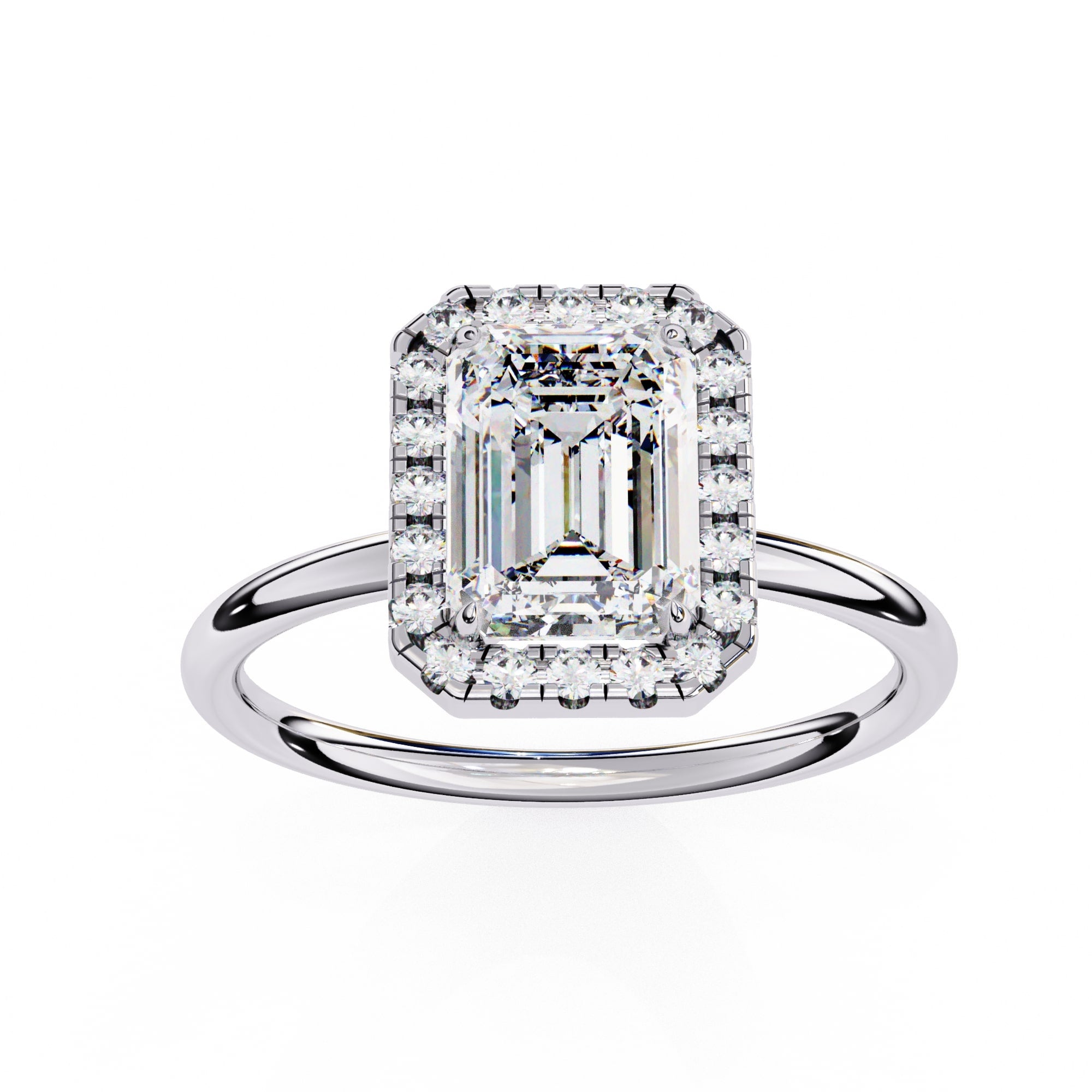 Diamond ring with emerald-cut center stone on a white background