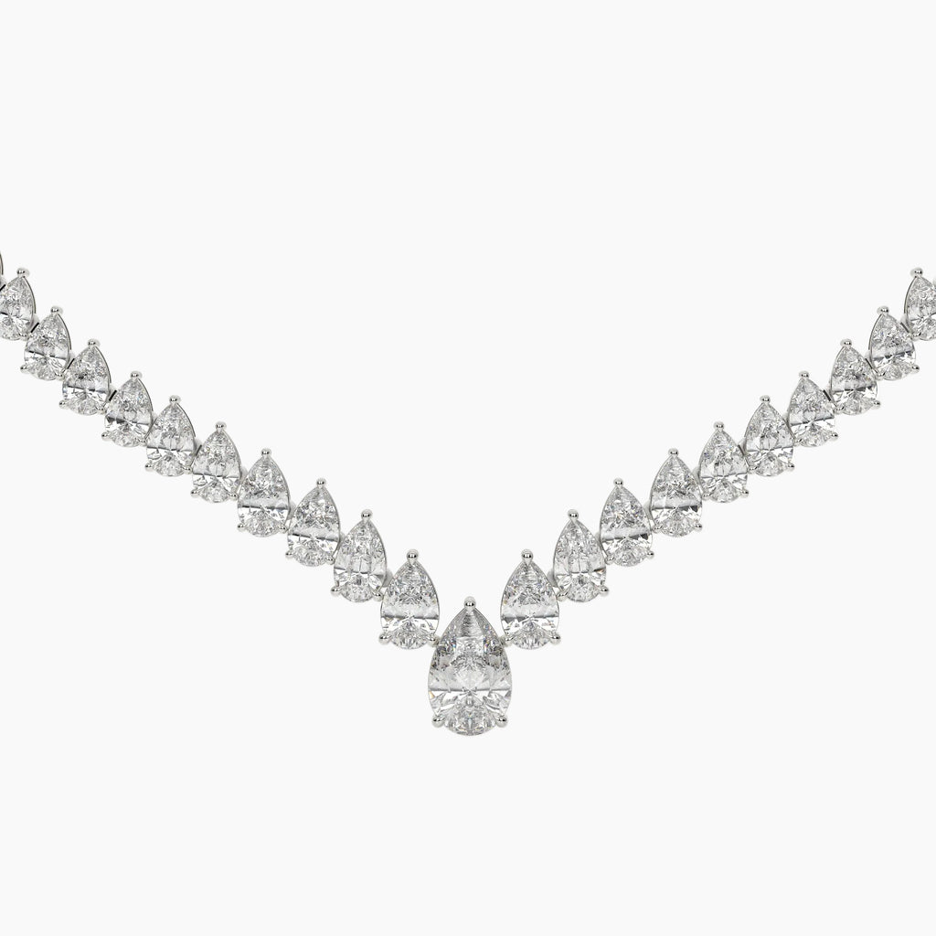 Diamond necklace with pear-shaped and round diamonds on a white background