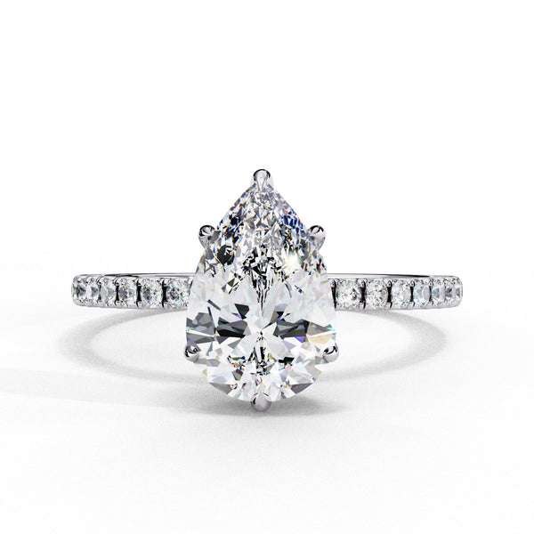 Diamond ring with a pear-shaped center stone on a white background