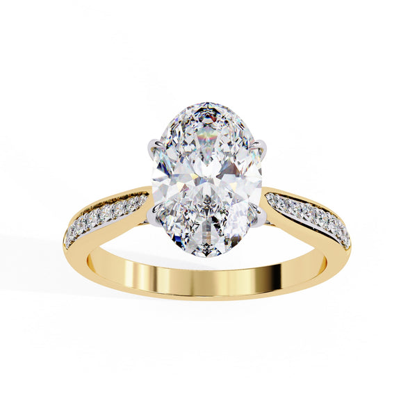 Gold ring with a large diamond and smaller diamonds on the band against a white background