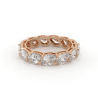 Rose gold ring with diamonds on a white background