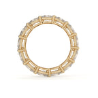 Gold ring with diamond accents on a white background