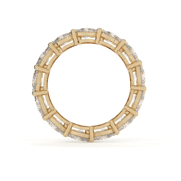 Gold ring with diamond accents on a white background