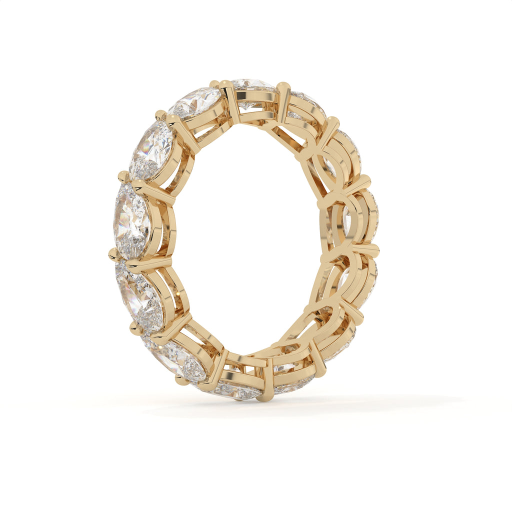 Gold ring with diamond accents on a white background