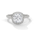 Cushion cut diamond halo engagement ring in white gold with a plain band, shown in a front product view.