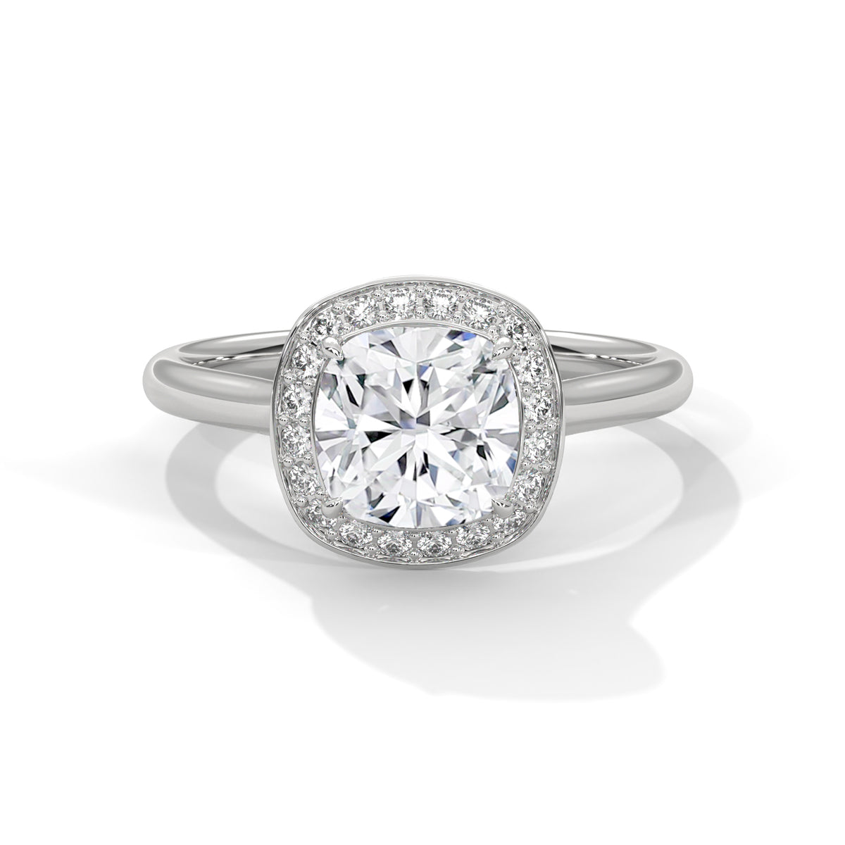 Cushion cut diamond halo engagement ring in white gold with a plain band, shown in a front product view.