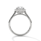 Side profile of a cushion cut diamond halo engagement ring in white gold with an open gallery setting and plain band.