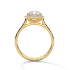 Side profile of a cushion cut diamond halo engagement ring in yellow gold with a pavé diamond band and open gallery setting.