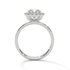 Side profile of a cushion cut diamond halo engagement ring in white gold with a plain band and raised halo setting.
