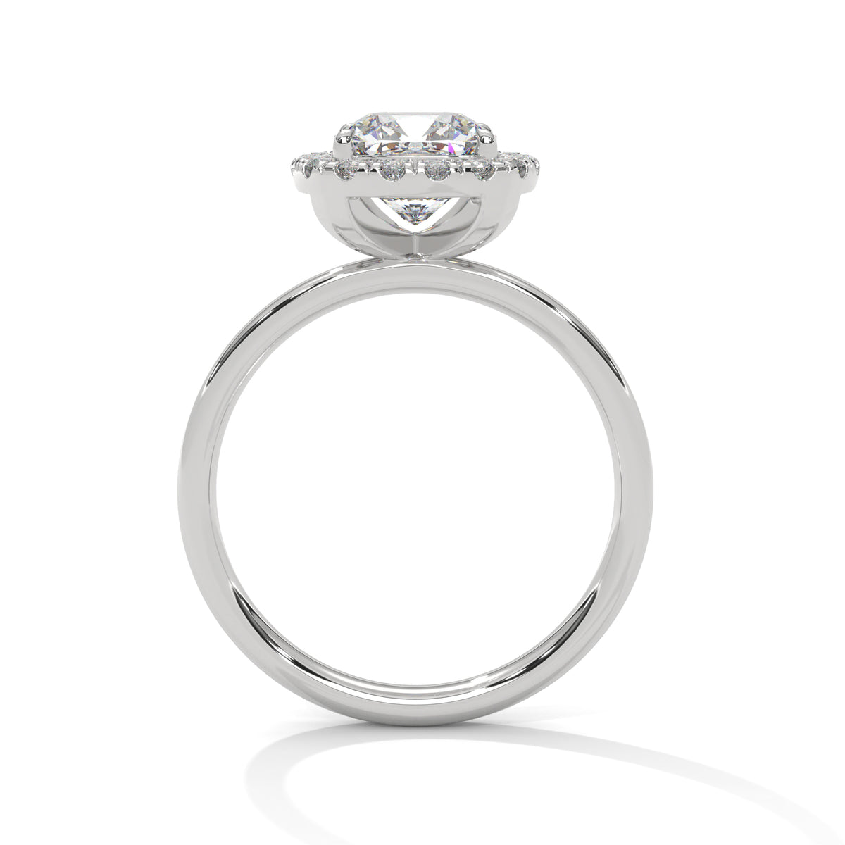 Side profile of a cushion cut diamond halo engagement ring in white gold with a plain band and raised halo setting.