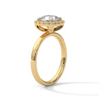 Angled side view of a cushion cut diamond halo engagement ring in yellow gold with a plain band and raised halo setting.