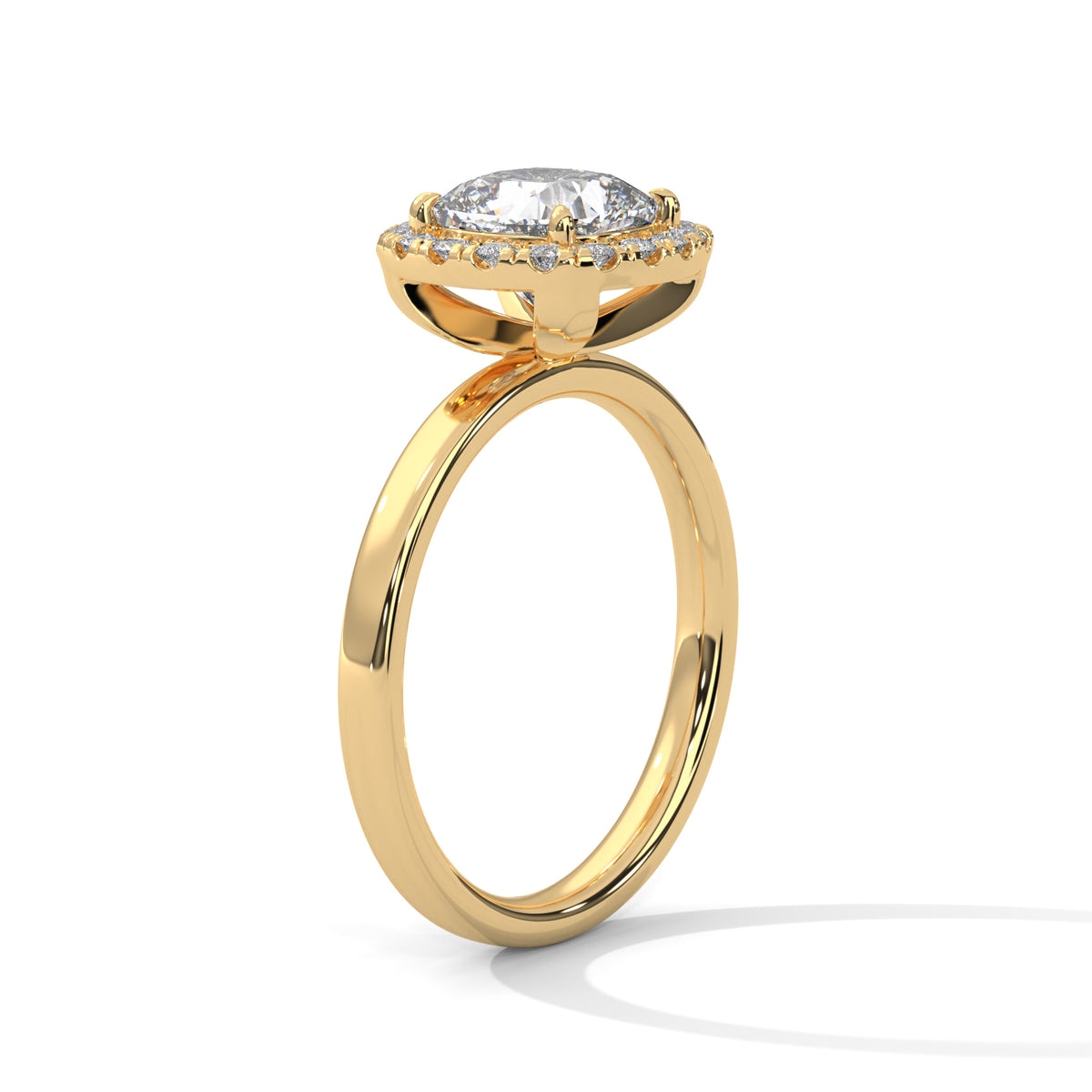 Angled side view of a cushion cut diamond halo engagement ring in yellow gold with a plain band and raised halo setting.