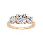 Rose gold ring with three diamonds on a white background