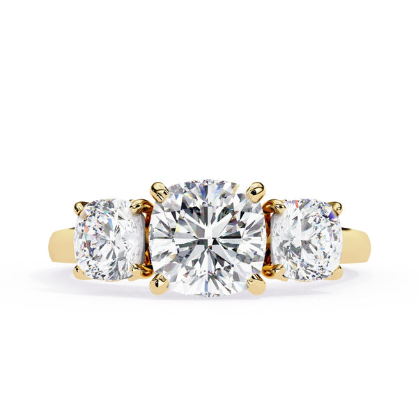 Gold ring with three round diamonds on a white background