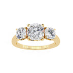 Gold ring with three round diamonds on a white background