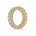 Gold ring with diamond accents on a white background