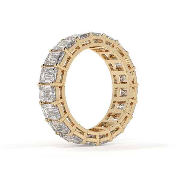 Gold ring with diamond accents on a white background
