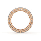Rose gold ring with diamond accents on a white background