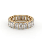 Emerald cut diamond eternity ring featuring a prong setting on a plain background.