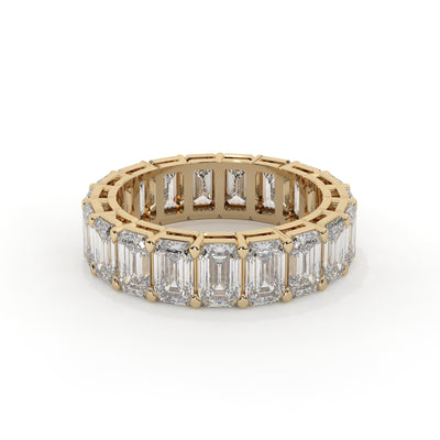 Emerald cut diamond eternity ring featuring a prong setting on a plain background.