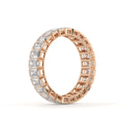 Rose gold and silver eternity ring with diamond accents on a white background
