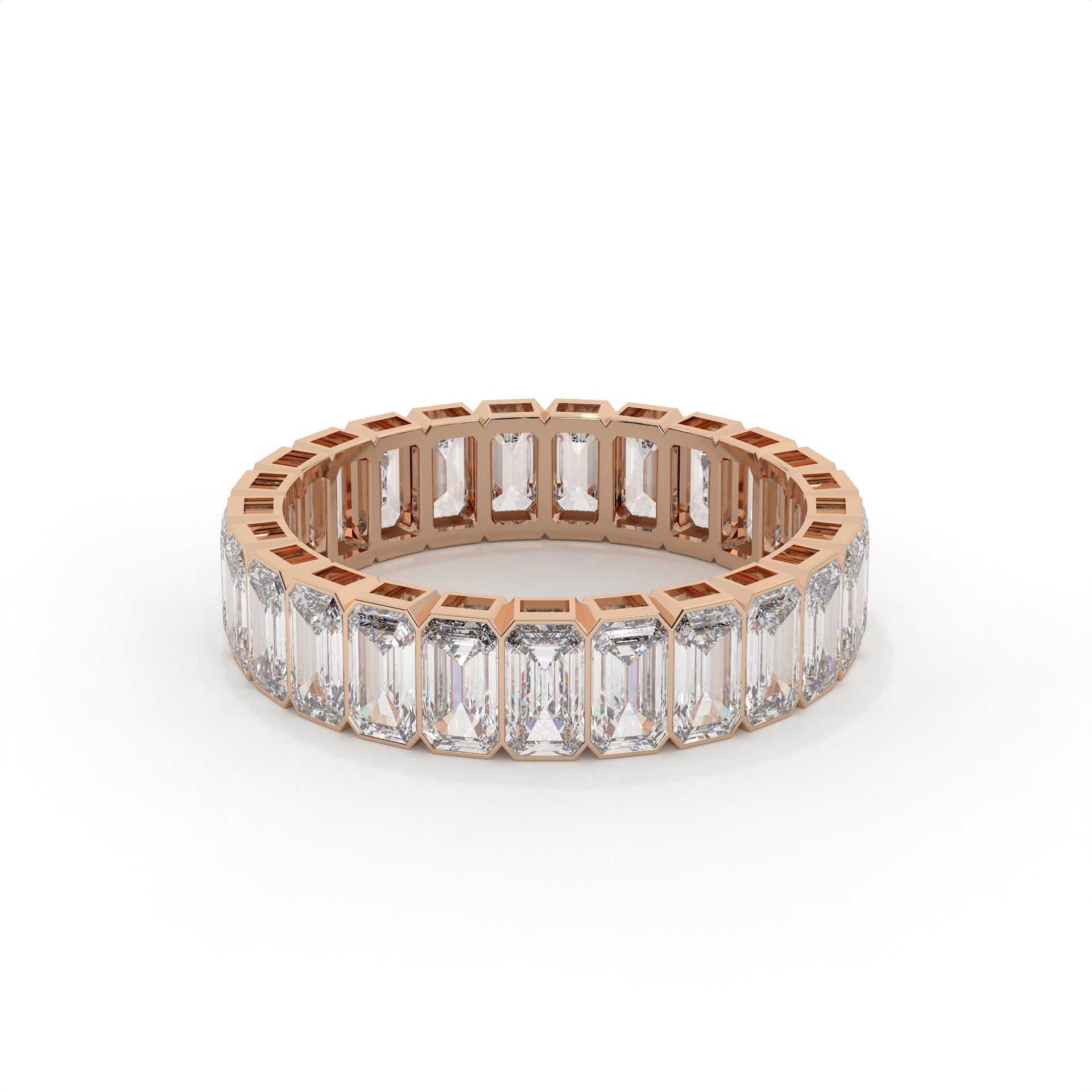 Rose gold ring with emerald-cut diamonds on a white background