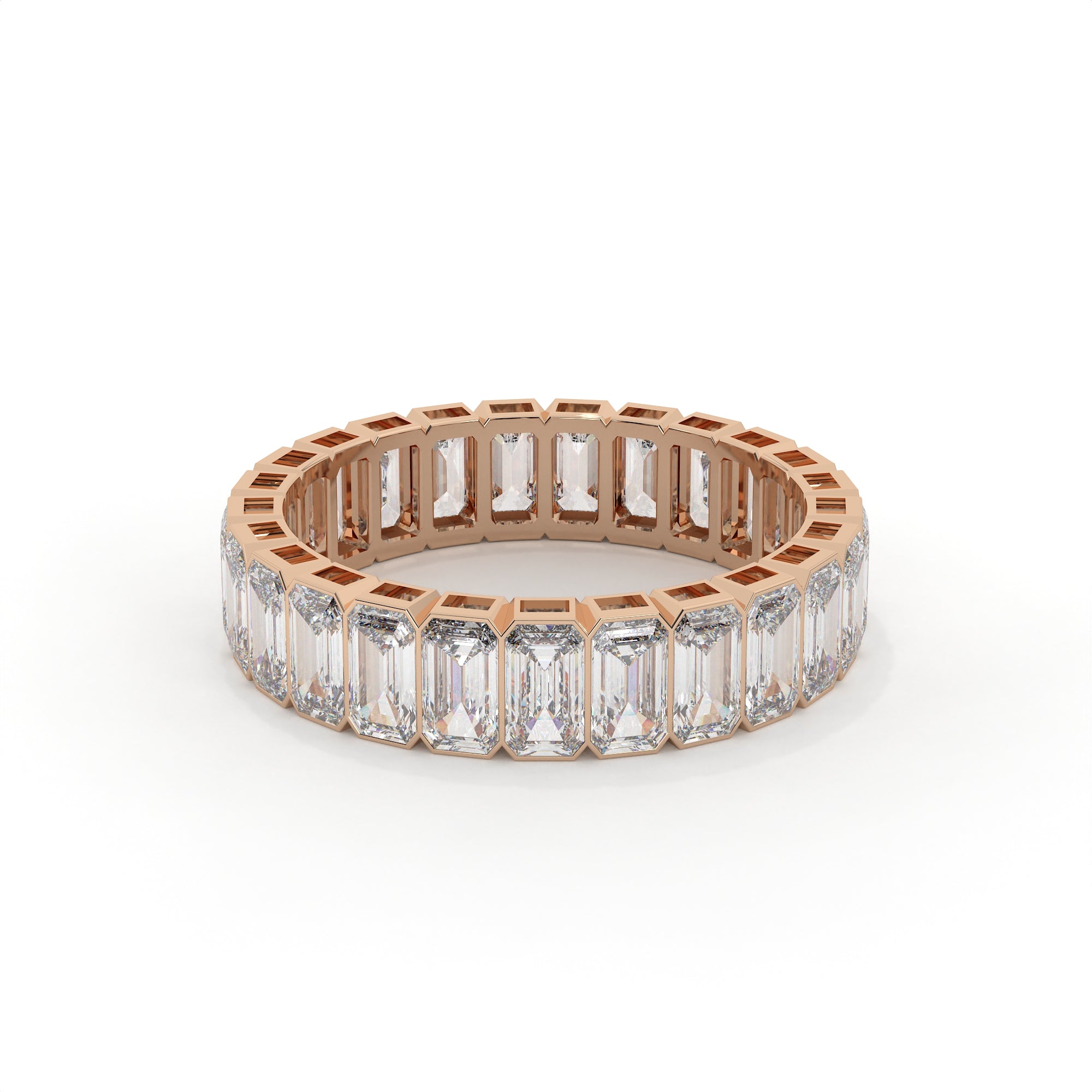 Rose gold ring with emerald-cut diamonds on a white background