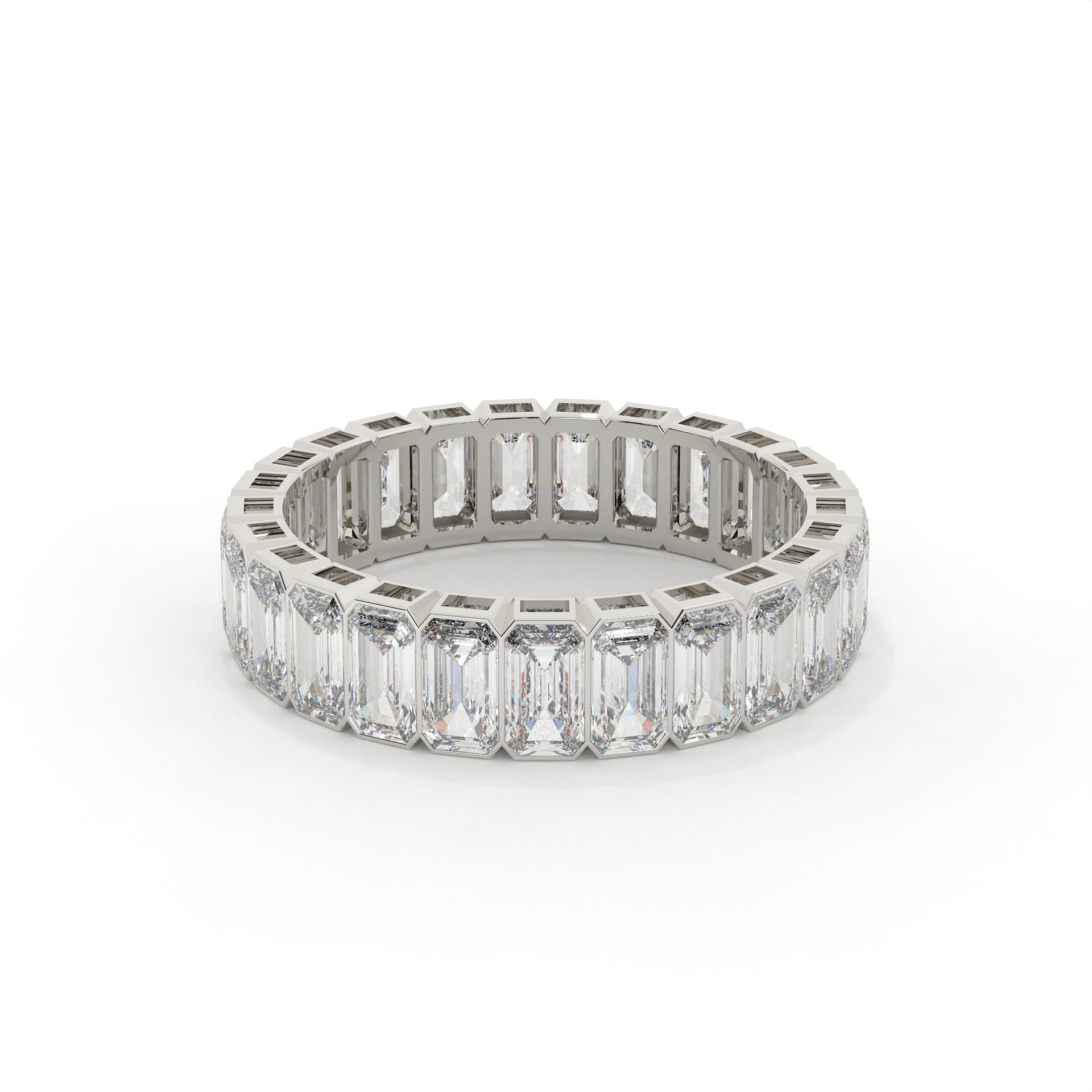 Diamond ring with emerald-cut stones on a white background