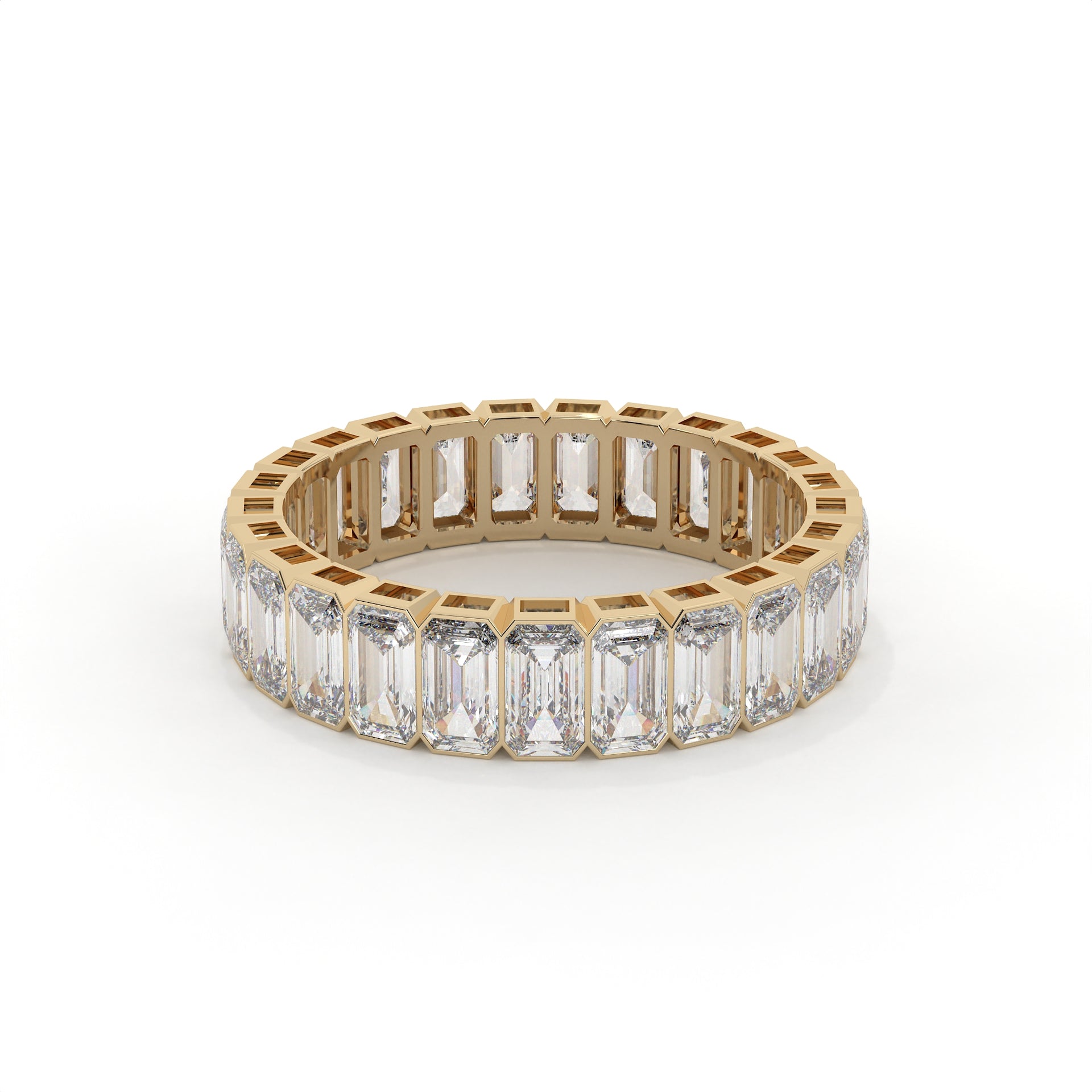 Gold ring with emerald-cut diamonds on a white background