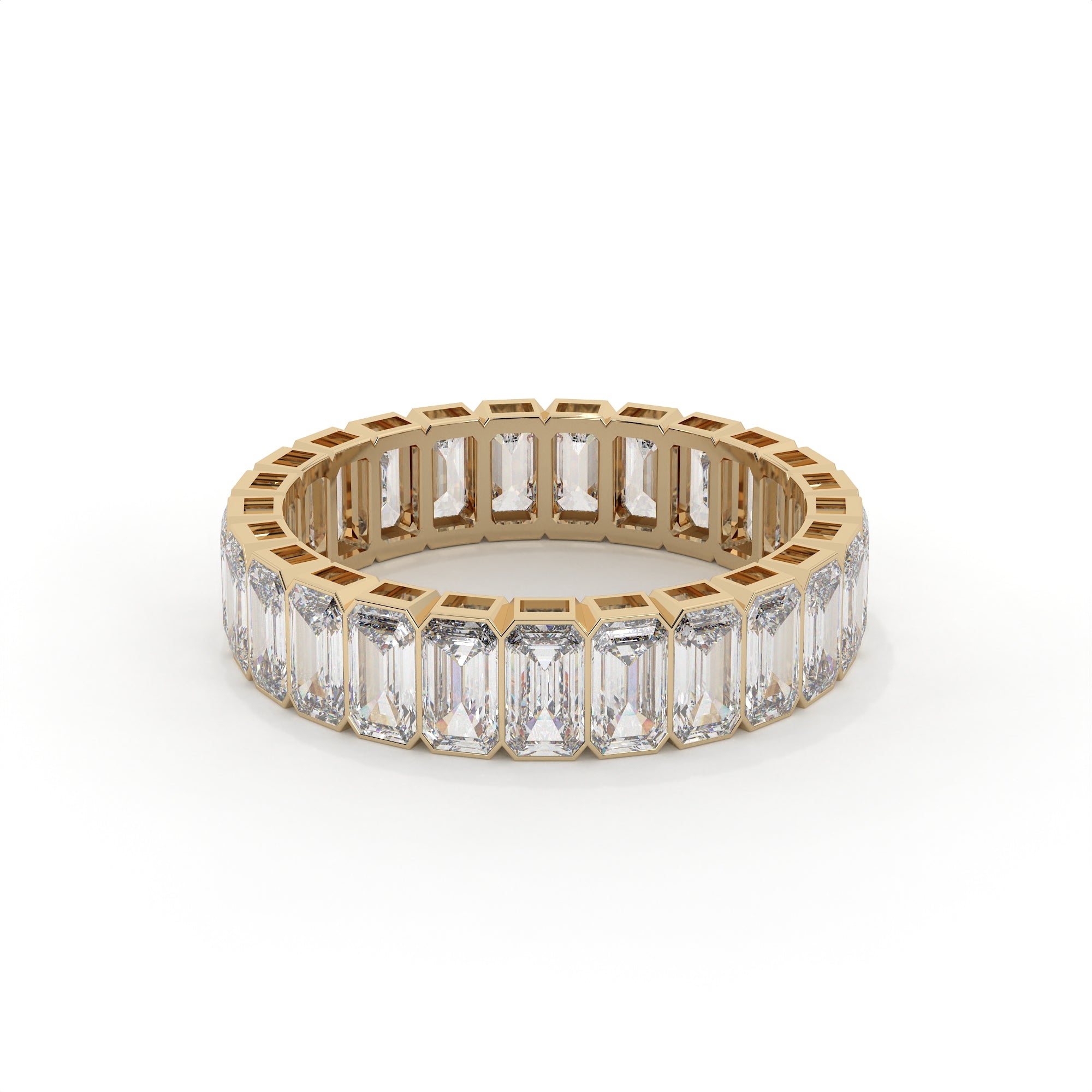Gold ring with emerald-cut diamonds on a white background