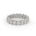 Silver ring with multiple diamonds on a white background
